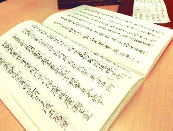 Copied manuscript of the Nihon Shoki used in class. The text is handled with great care.