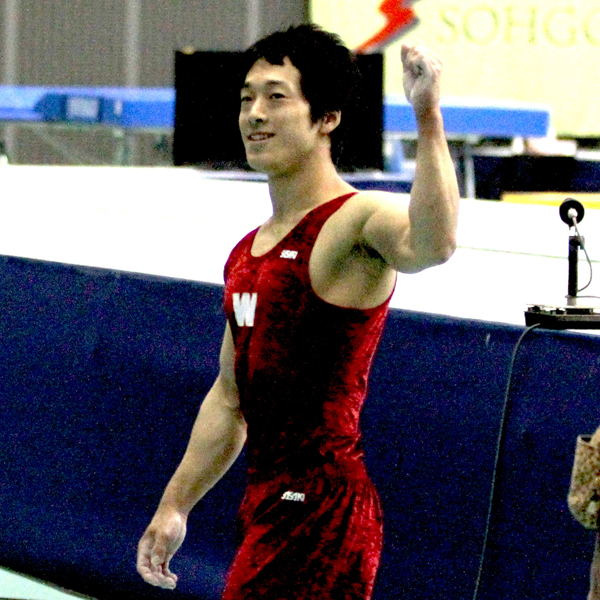 Ogura striking a victorious pose after completing his performance in the individual events at the All Japan Student Championships.