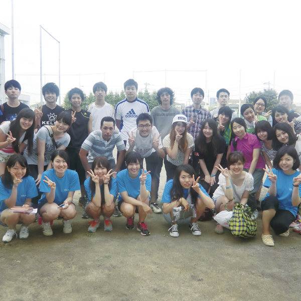 A commemorative photo of futsal tournament for refugees. Each year dozens of volunteers serve as staff for the event.