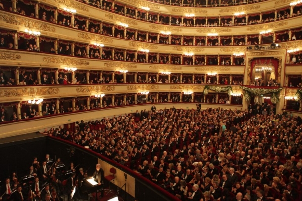 This handout picture taken on December 7, 2012 and released by the press office of La Scala opera house in Milan shows conductor Daniel Barenboim (C) conducting the orchestra during Don Giovanni, opening the 2011-2012 season of La Scala opera house. Mozart's Don Giovanni is conducted by the new musical director of La Scala, Israeli-Canadian Daniel Barenboim and staged by Canadian Robert Carsen. AFP PHOTO / TEATRO ALLA SCALA/HO RESTRICTED TO EDITORIAL USE - MANDATORY CREDIT "AFP PHOTO / TEATRO ALLA SCALA /Brescia/Amisano " - NO MARKETING NO ADVERTISING CAMPAIGNS - DISTRIBUTED AS A SERVICE TO CLIENTS / AFP PHOTO / Teatro alla Scala / Brescia/Amisano